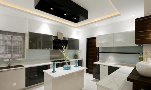 Kitchen with neutral tones, marble countertops, and stylish accents.